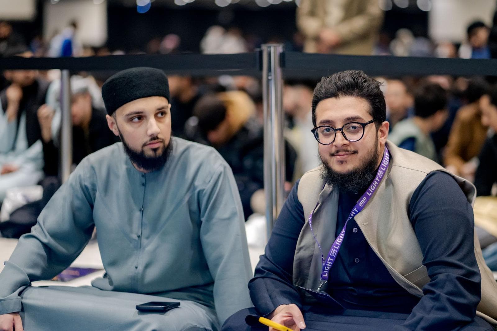 Adil Yusuf at a community event with a fellow attendee